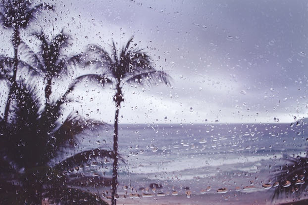 closeup of raindrops on impact hurricane coastal window